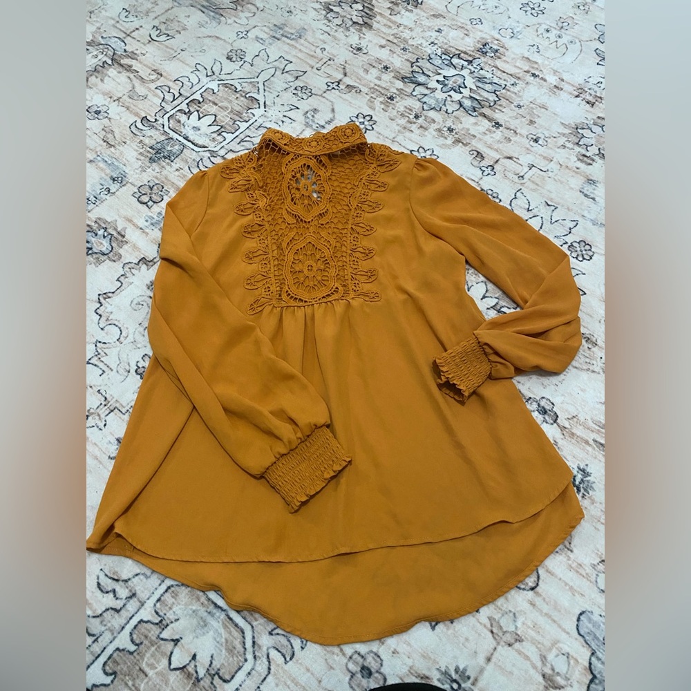 Yellow mustard shirt.